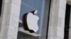 (FILES) The Apple logo is seen at the entrance of an Apple store in Washington, DC, on September 14, 2021.