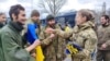 Ukrainian POWs are seen after swap at unknown location in Ukraine